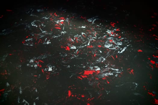 Black background with red, white, gray and blue strokes, dashes, stains and scuffs. A ray of light