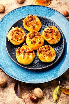 Homemade freshly baked buns with nuts. Fall sweets, autumn dessert