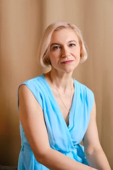 Portrait of senior woman in blue dress