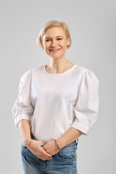 Studio portrait of happy senior woman