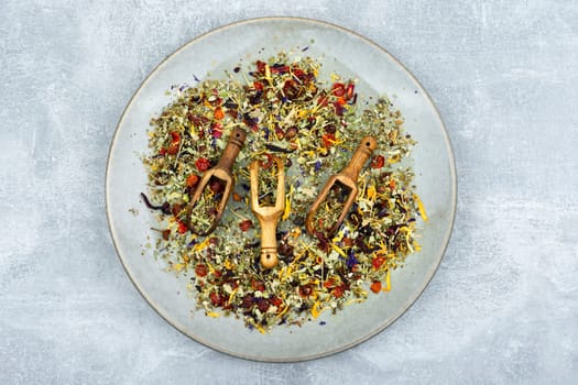 Herbal tea with healthy herbs in scoop. Natural herbal medicine. Flat lay