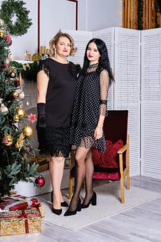 Mother and daughter celebrate christmas together. Family relations concept.