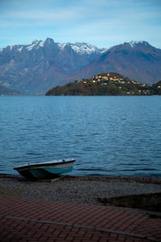 Boat on the beach of a lake, vertical view