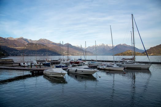 Small harbour and pier with boats on the lake