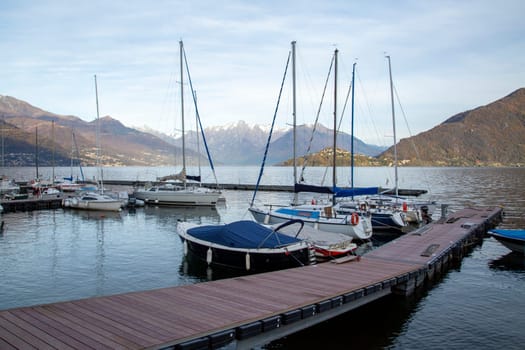 Small harbour and pier with boats on the lake