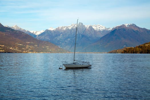 Lonely boat in a lake, sunset light, horizontal view