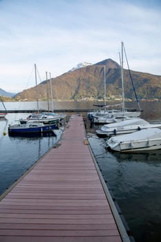 Small harbour and pier with boats on the lake