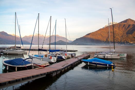 Small harbour and pier with boats on the lake