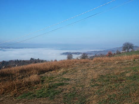 Foggy landscape of hills and trees, horizontal view