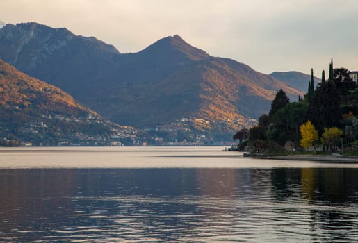 Lake and mountains under sunset light, landscape view