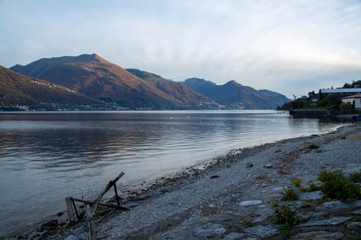 Lake and mountains under sunset light, landscape view
