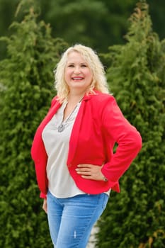 Lifestyle portrait of middle-aged woman outdoors