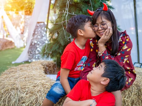 Mother and daughter dressed in red celebrating Christmas. Christmas Festival.