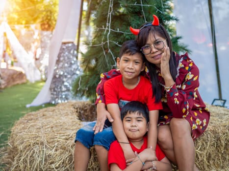 Mother and daughter dressed in red celebrating Christmas. Christmas Festival.