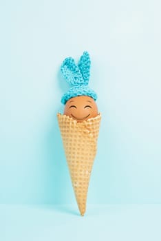 Cute easter bunny or rabbit with a smiling egg face in an ice cream cone, spring holiday, greeting card