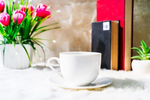 Coffee cup with book stacked on table,Coffee time in the morning