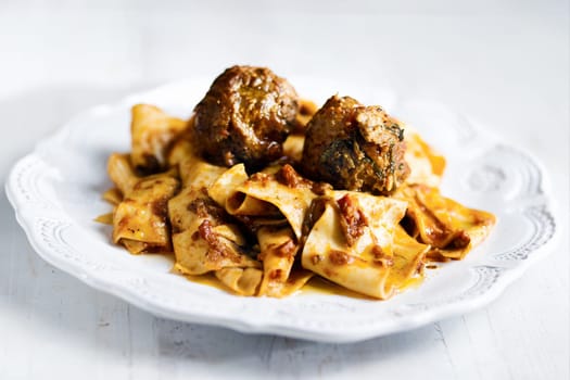 rustic italian tradtional comfort food pappardelle in meatball bolognese sauce