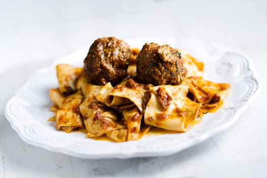 rustic italian tradtional comfort food pappardelle in meatball bolognese sauce