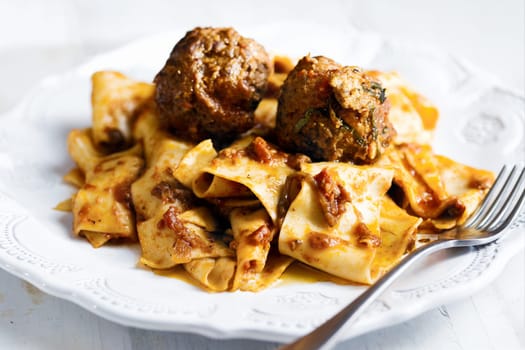 rustic italian tradtional comfort food pappardelle in meatball bolognese sauce