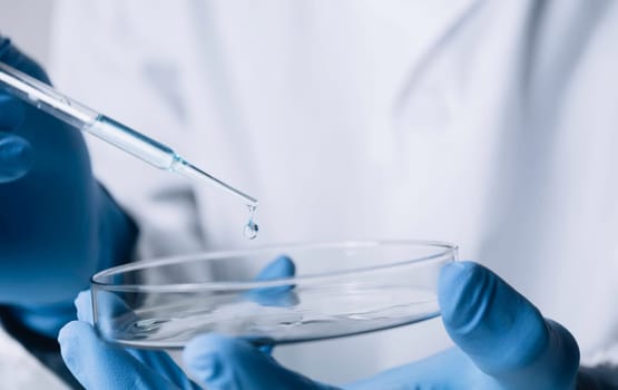 Researcher with glass laboratory chemical test tubes with liquid for analytical , medical, pharmaceutical and scientific research concept.