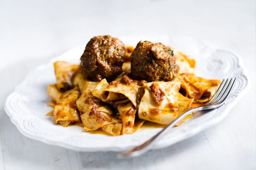 rustic italian tradtional comfort food pappardelle in meatball bolognese sauce