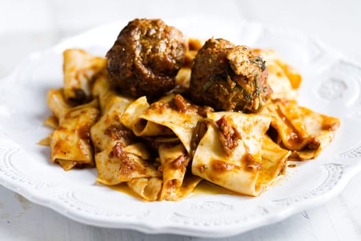rustic italian tradtional comfort food pappardelle in meatball bolognese sauce