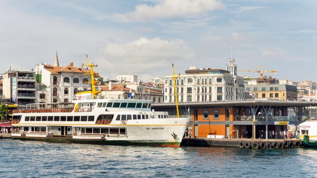 Istanbul, Turkey - September 1, 2022: Ferry boat docked at Karakoy ferry terminal, in a sunny summer day