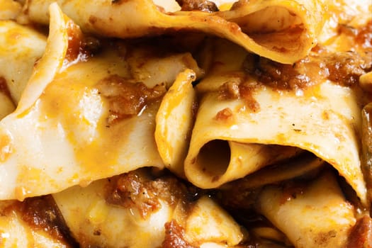 rustic italian tradtional comfort food pappardelle in bolognese sauce background