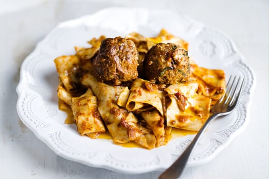 rustic italian tradtional comfort food pappardelle in meatball bolognese sauce