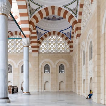 Istanbul, Turkey - September 1, 2022: Roofed passage at the courtyard of Grand Camlia Mosque, or Buyuk Camlica Camii, a modern Islamic complex, built in 2019, located in Camlica hill, Uskudar