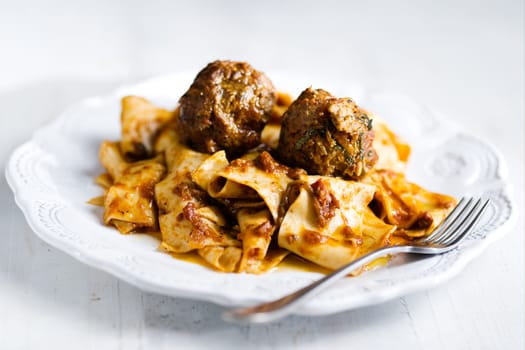 rustic italian tradtional comfort food pappardelle in meatball bolognese sauce