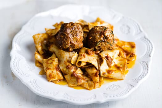 rustic italian tradtional comfort food pappardelle in meatball bolognese sauce