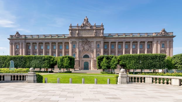 Facade of Riksdagshuset, the Swedish Parliament House, located on the island of Helgeandsholmen, Old town, or Gamla Stan, Stockholm, Sweden, in a summer day