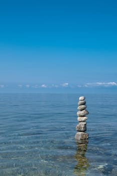 balanced stones on the rocks of the sea....................................