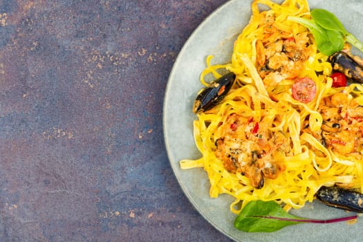 Pasta spaghetti with seafood. Cooking mediterranean food. Light gray background