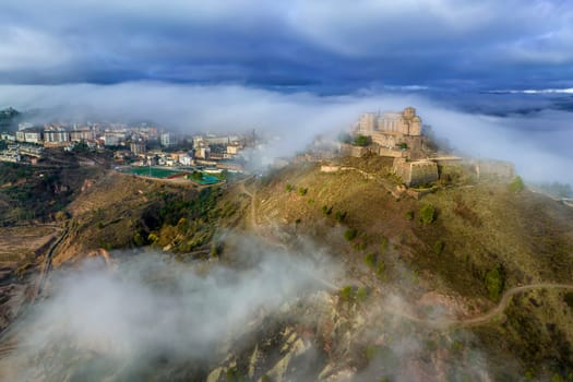 Cardona castle is a famous medieval castle in Catalonia. Between very dense fog that hides the city