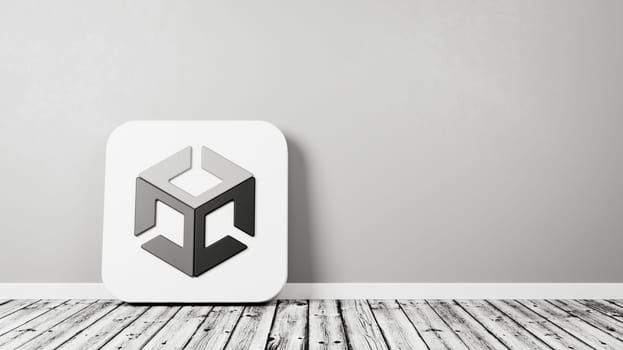 Unity App Icon 3D Symbol Shape on Wooden Floor Against Gray Wall with Copy Space 3D Render Illustration
