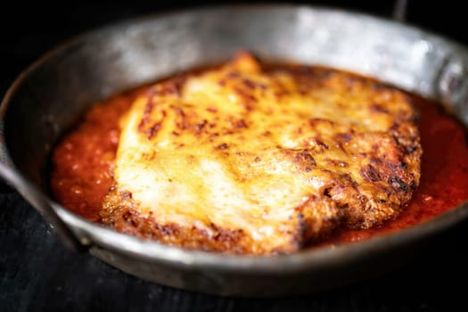 closeup of pan of rustic italian chicken parmesan comfort food