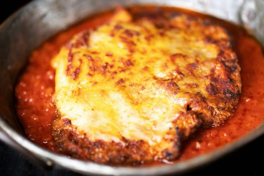 closeup of pan of rustic italian chicken parmesan comfort food
