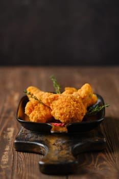 Classic fast food - deep fried spicy chicken meat closeup