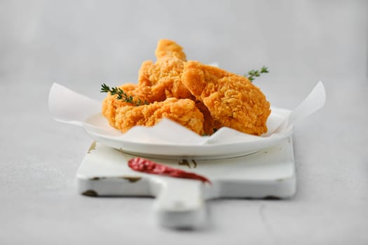Closeup photo with shallow depth of field of deep fried spicy chicken meat