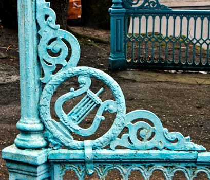 Old iron fence on a natural background close-up.
