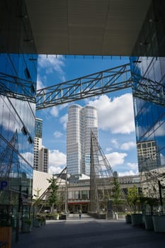 View from the glass facades of the Kranzlereck to the tower of the Upper West, the new landmark of Berlin