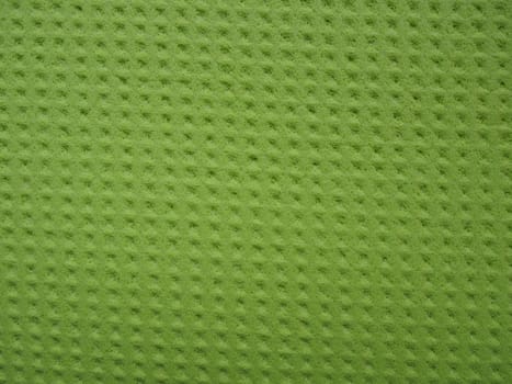 Sponge fibers sponge texture pattern surface close-up green yellow background.