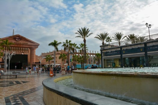 Centro Comercial Safari Shopping Mall, Playa de la Americas, Tenerife, Spain August 12, 2022 - Water fountain overlooking the Hard Rock Cafe with blue sky