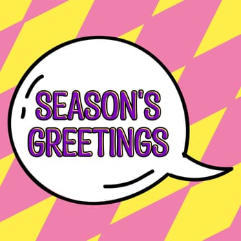 Sign displaying Season's Greetings, Word Written on Used as an expression of goodwill during festivities