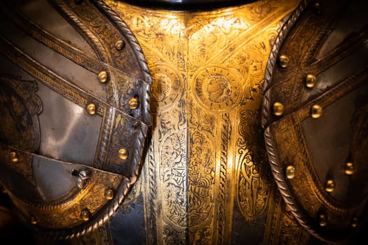 Antique armour on black background. Concept for security, safety and fantasy
