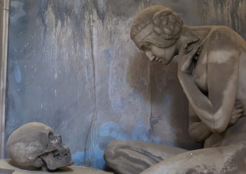 GENOA, ITALY - June 2020: antique statue, beginning 1800, made of marble, in a Christian Catholic cemetery - Italy