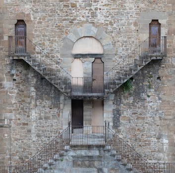 Exterior of antique building with Escher architecture style. Simmetry and geometric perspective.