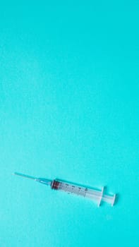 Vaccination debate concept. Biotechnology banner with medical syringe. Copyspace for text. flatlay.